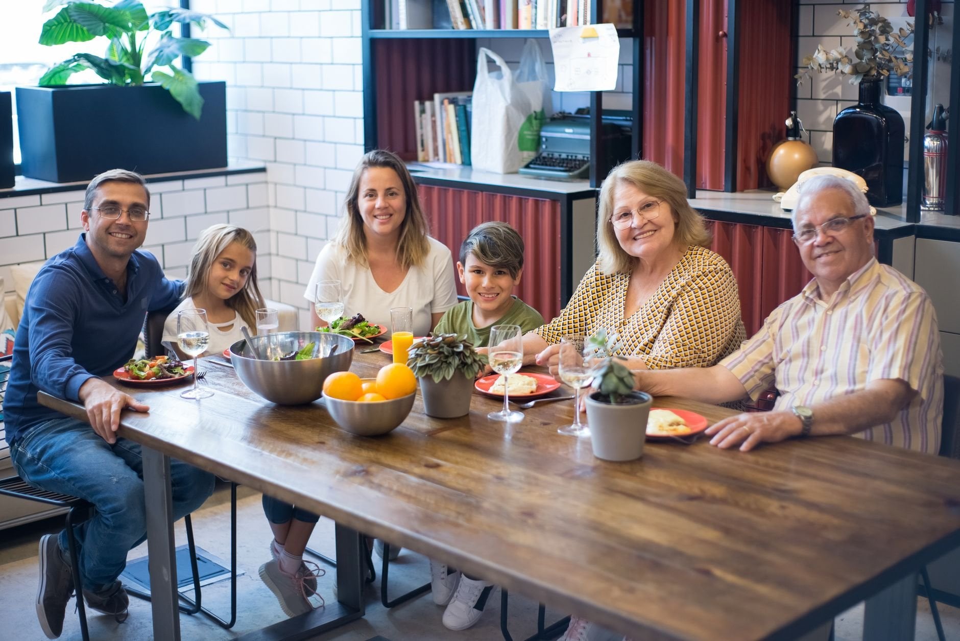 Family sharing a meal at home, capturing joy and togetherness indoors.